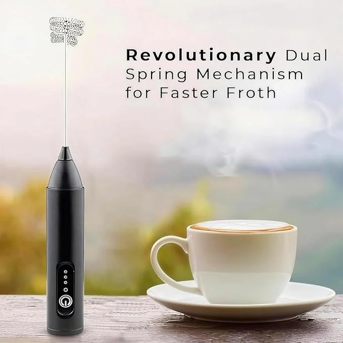 ELvora frother beside a fresh latte on a marble table